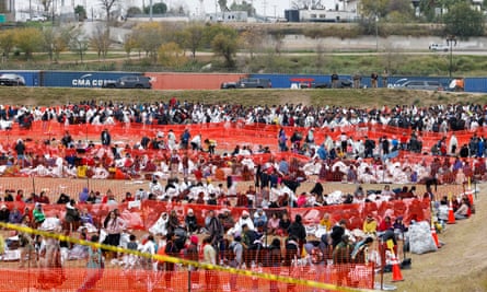 Migrants are gathered at Shelby Park in Eagle Pass, Texas, on 21 December. It has been reported over the past few days that an average of 12,000 migrants have crossed the border.