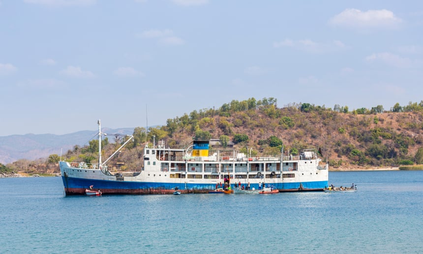 Smaller boats shuttle passengers to and from the Ilala on Lake Malawi