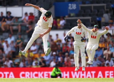 Cameron Green leaps for the ball.
