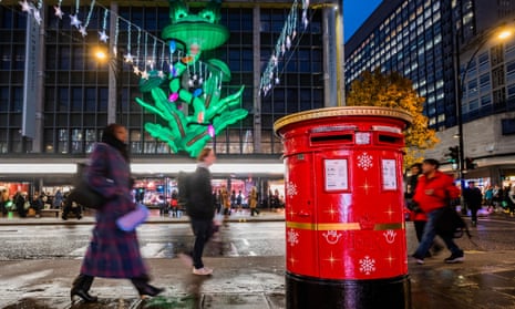 A Royal Mail post box which plays carols when a letter is posted. Oxford Street, London, 4 December 2023.