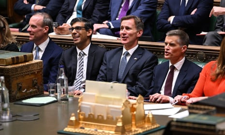 Chancellor Jeremy Hunt with prime minister Rishi Sunak in the House of Commons, after delivering his autumn statement on 17 November.