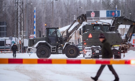 Vehicles of the Finnish Defence Forces (FDF) are seen at the Vartius border station to provide assistance to the Border Guard to build a temporary barrier, in Kuhmo, Finland, 19 November.