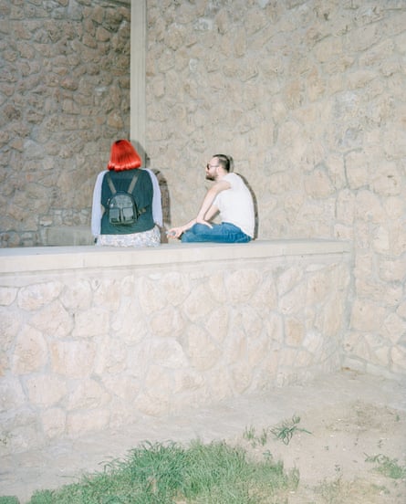 Two friends talk together outside a cultural centre in Tehran