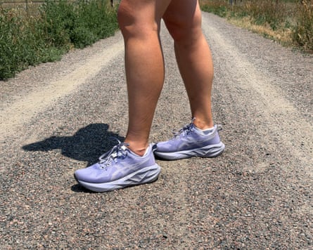 a person wearing Asics Novablast 5 shoes on a trail outside