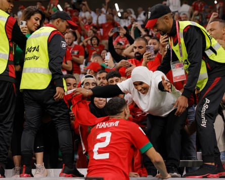 Achraf Hakimi, who scored the winning penalty for Morocco, greets his mother after the match against Spain in Doha, Qatar, 6 December 2022
