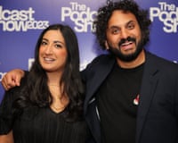 Coco Khan and Nish Kumar smile with arms around each other at the Podcast Show