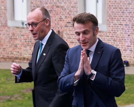 Merz and Emmanuel Macron during an EU leaders’ retreat in Bilzen, Belgium, February 2026.