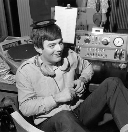 Tony Blackburn balances a single on his head at the opening of BBC Radio 1 in 1967.