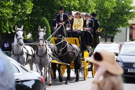 Racegoers arriving at Ascot in a horse-drawn carriage.