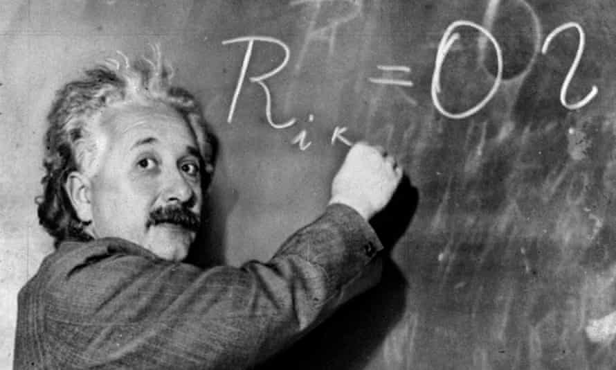Albert Einstein writes out an equation for the density of the Milky Way on the blackboard in 1931