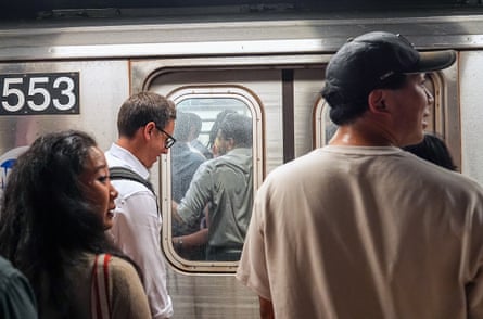 people wait for a train