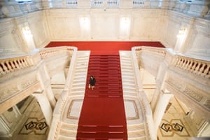 A woman walks down some stairs inside the Romanian Parliament, in Bucharest.