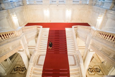 A woman walks down stairs inside the Romanian parliament in Bucharest