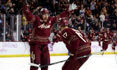 Lawson Crouse of the Arizona Coyotes, left, celebrates a goal with Nick Bjugstad during a November game. 