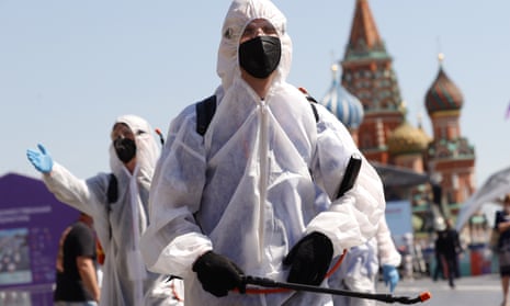 Workers disinfect a book fair at Red Square in Moscow.