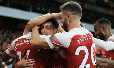 Arsenal players, among them Mesut Özil, celebrate during their 3-1 victory over Leicester City on Monday. Unai Emery’s men have now won 10 successive games in all competitions
