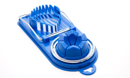 Blue egg slicer on white background