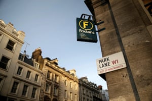 A Park Lane street sign sits on the wall of a Foxtons Ltd. estate agents in the Westminster district of in London.