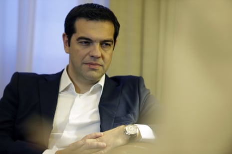 <br>Greece’s Prime Minister Alexis Tsipras listens to Greek President Prokopis Pavlopoulos tonight.