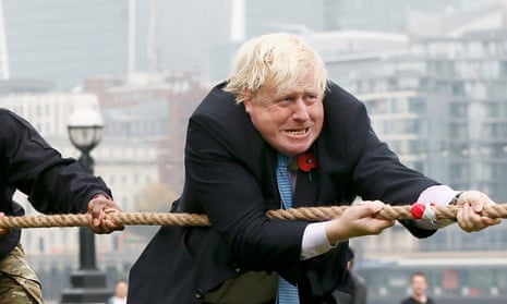 Boris Johnson takes part in a tug of war with members of the armed services in 2015, when London mayor.