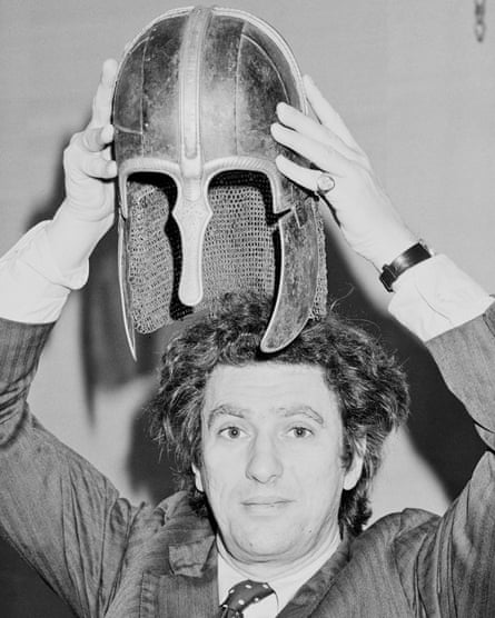 Lord Gowrie holding the Coppergate Helmet (York Helmet), an Anglo-Saxon helmet, above his head in London on 6 March 1984.