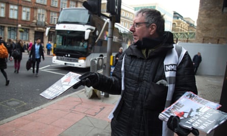 A vendor hands out the final copy of NME at London Bridge, 9 March.