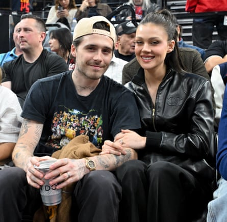 Brooklyn Beckham and Nicola Peltz at a basketball game