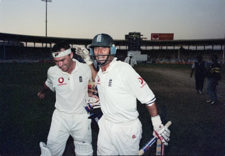 Nasser Hussain and Graham Thorpe celebrate a series win in the twilight dark of the third Test in Karachi in 2000.