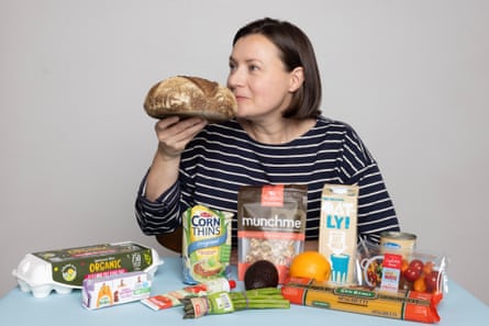 Emma Joyce smelling a loaf of bread