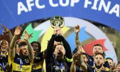 Central Coast Mariners players celebrate winning the AFC Cup.