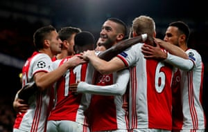 Ajax players celebrate after scoring early at the Bridge.