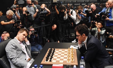 Reigning FIDE world chess champion Magnus Carlsen (right), defends his  title against US challenger Fabiano Caruana, during the first game of the  FIDE World Chess Championship at The College, Southampton Row in
