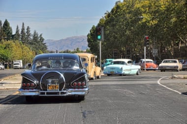 A convoy carries the ashes of Sonny Madrid, co-founder of Lowrider magazine, to the cemetery.