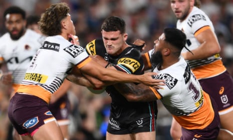 Nathan Cleary of Penrith Panthers is tackled by Reece Walsh and Payne Haas of Brisbane Broncos during the NRL Grand Final 2023