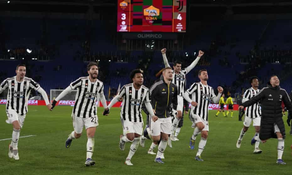 Juventus players celebrate in front of their fans at the Stadio Olimpico after the 4-3 victory over Roma.