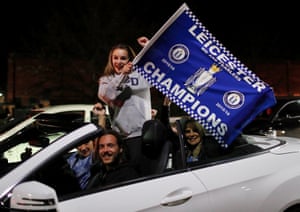 Leicester City fans celebrate outside the King Power stadium