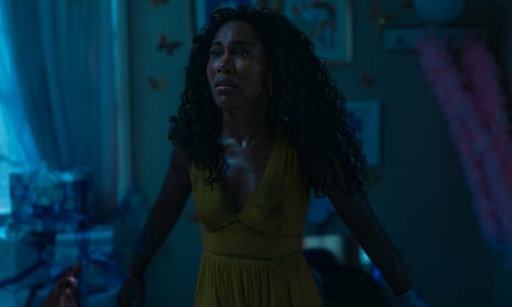 woman in a yellow dress in a bedroom in the dark