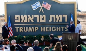 Israel’s prime minister, Benjamin Netanyahu (right) and the US ambassador to Israel, David Friedman (left), applaud after unveiling the place-name sign for a new settlement during an official ceremony in the Golan Heights in June last year