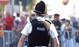 Police officer on foot patrol in England