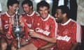 Alan Hansen, second from right, holds the First Division trophy after Liverpool were crowned champions for an 18th time in 1990