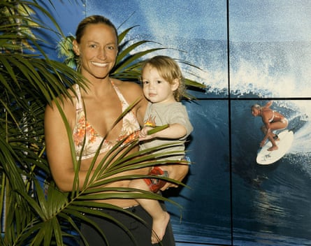 US surfer Lisa Andersen in 2003 with her child