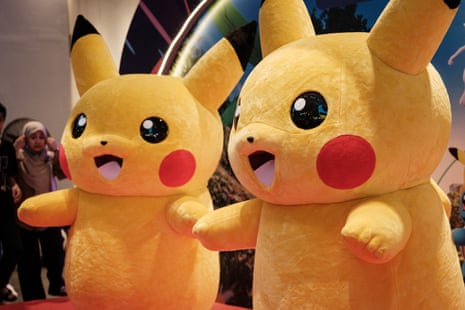 Two Pikachu mascots pose for a photograph during ‘Pokemon GO Fest: Global’.