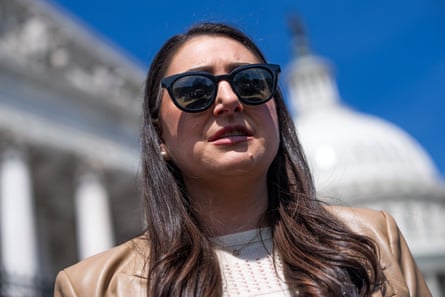A woman in sunglasses near the US Capitol.