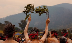 Yuin people gather at Gulaga mountain in early December as smoke clouds the sky, to perform a ceremony to heal the country. Fires swept through the region over the new year period.