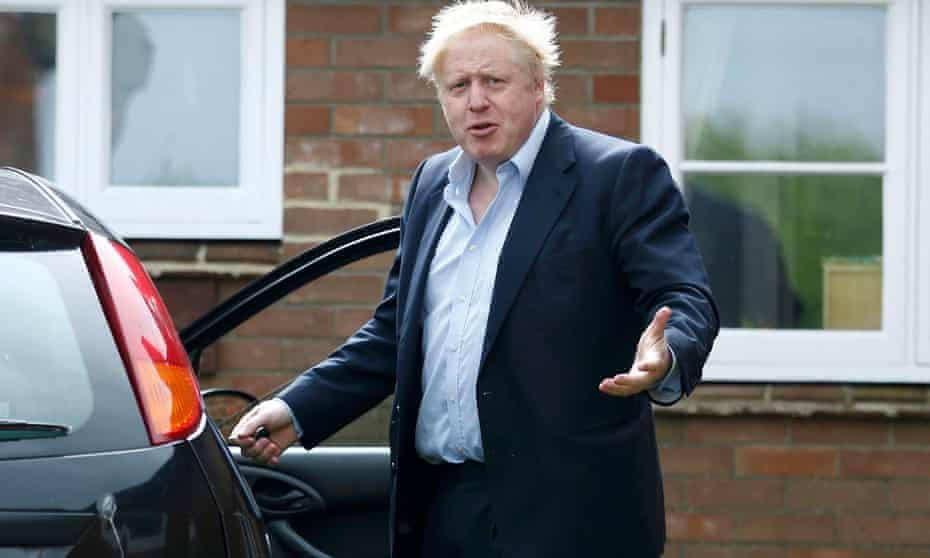 Boris Johnson gestures as he gets into his car at his home in Oxfordshire on Saturday