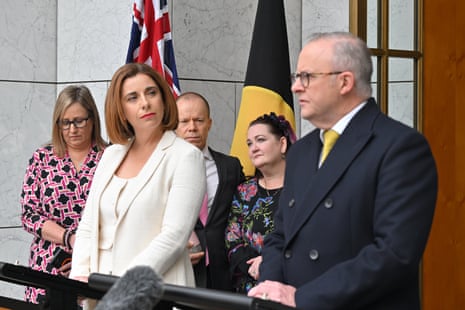 Anika Wells and Anthony Albanese hold a press conference alongside parents at Parliament House