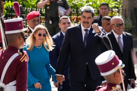 Nicolás Maduro with his wife, Cilia Flores, arrive at the National Assembly for his swearing-in ceremony
