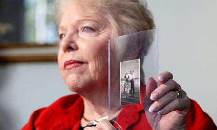 Diane Capone, granddaughter of Al Capone, talks about her memories of him while holding a photo featuring both of them and other family members, taken in 1946.