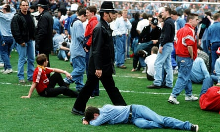 Liverpool supporters on the pitch at Hillsborough after the 1989 semi-final there had been abandoned.