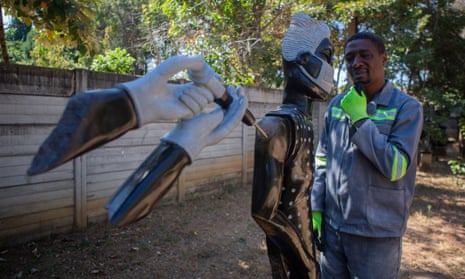 David Ngwerume shows his artwork called “Arms” in Harare, Zimbabwe. David Ngwerume is making Sculptures which is disseminating COVID-19 messages through his artwork. He has carved a sculptor called Arms which has become his signature piece during the pandemic.